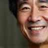 Photo of Mr. Kenji Tanaka smiling faintly